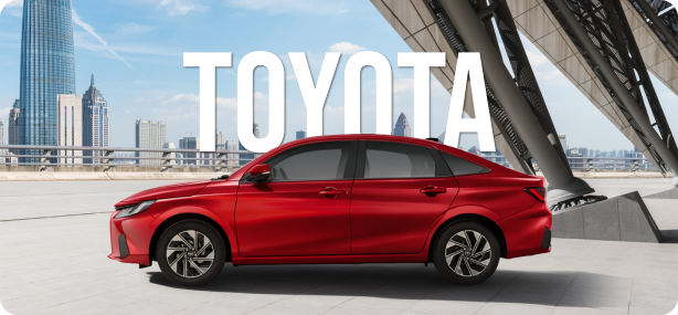 A toyota sitting in a car park outside with the text "Toyota" overlaid