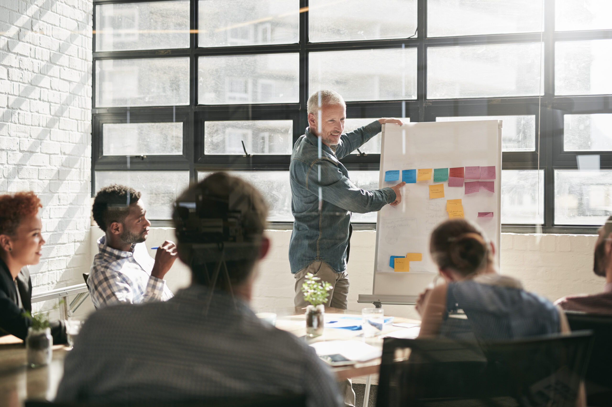 Kaizen Process Shot of a businessman giving a presentation to his colleagues.