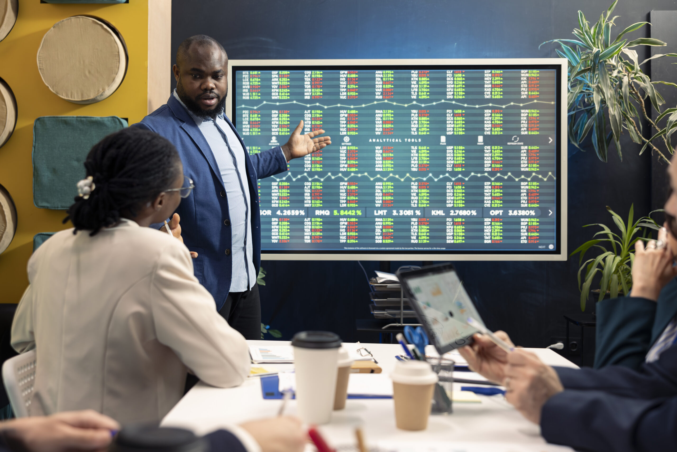 Strategy Deployment Team leader hosting a meeting in conference room and talking sense into his staff, trying to detect challenges or obstacles hindering progress. Manager and workers struggling with a project.